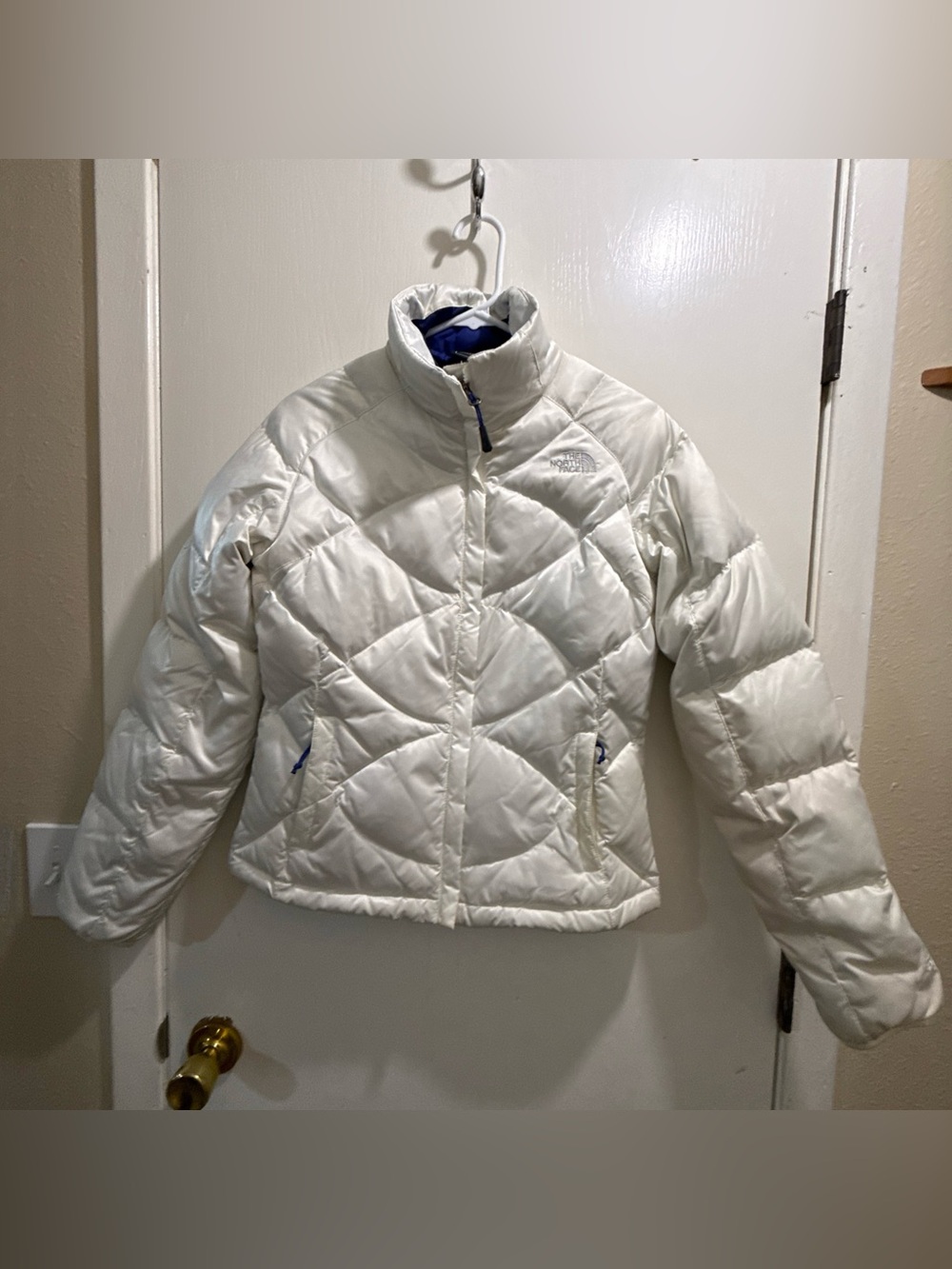 The North Face Girls' Cream White Quilted Puffer Jacket with Blue Accents